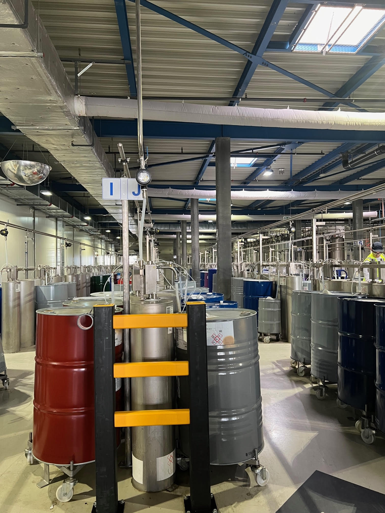 Rows of barrels inside a fragrance oil manufacturing facility.