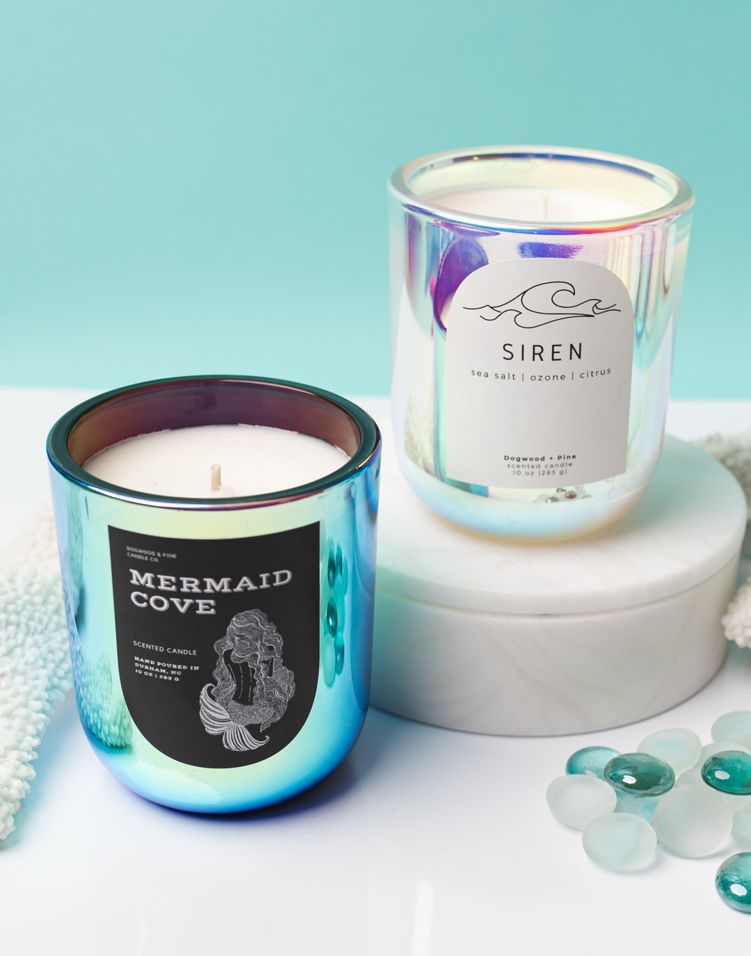 Mermaid candles with different labels.