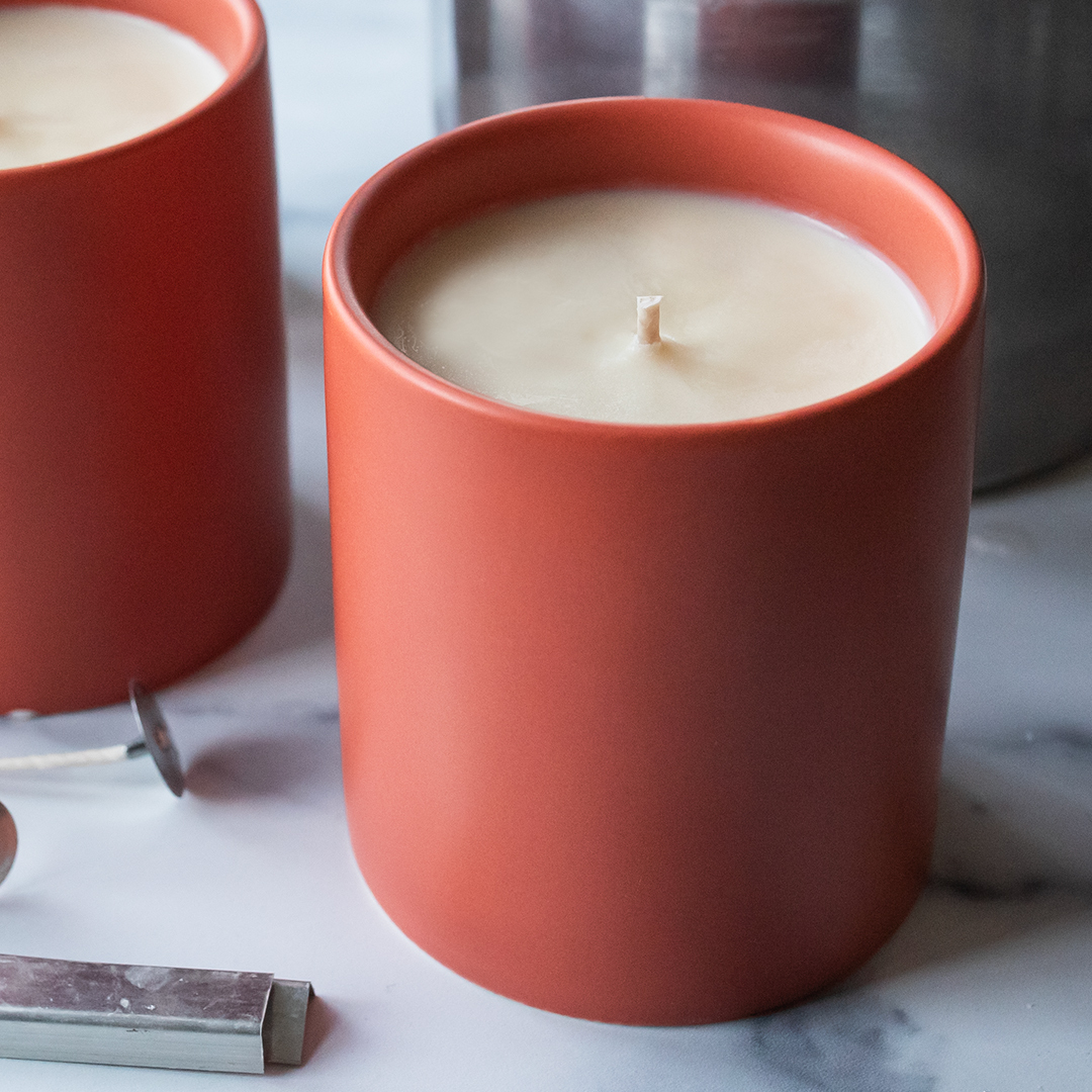 A soy candle in a terracotta Modern Ceramic Tumbler Jar made with Patchouli essential oil from CandleScience