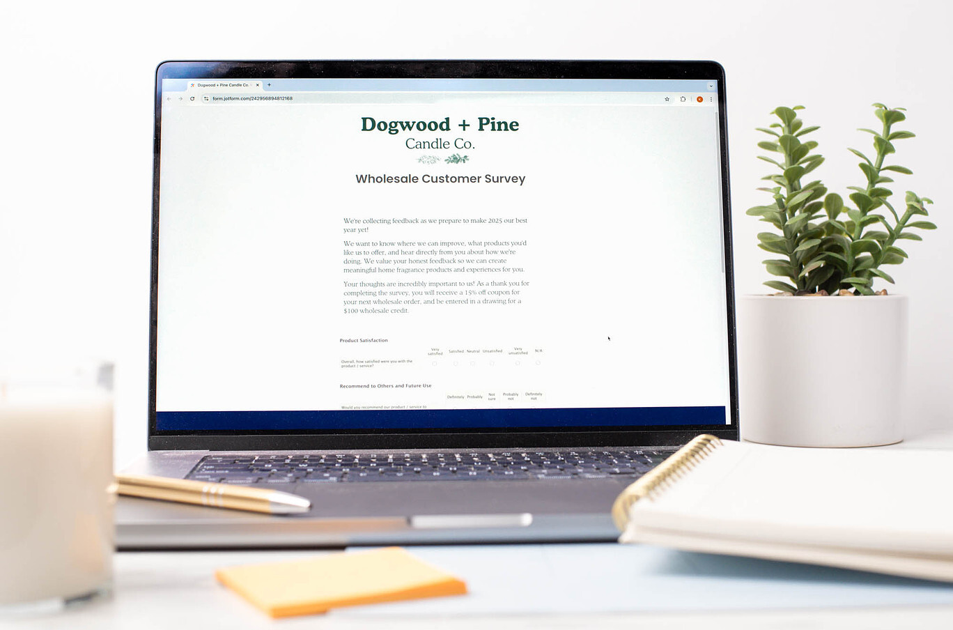 A laptop screen displays a wholesale customer survey from Dogwood + Pine Candle Co.