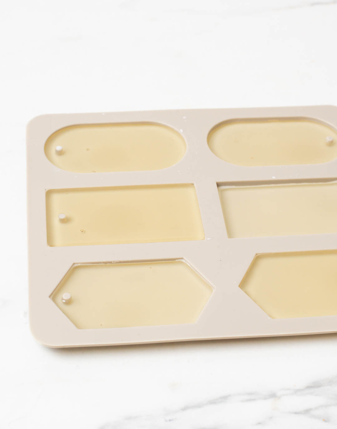 Melted wax in a silicone mold for DIY wax sachets.