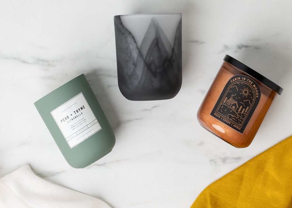 Frosted Swirl Sonoma, Eucalyptus Dream Ceramic, and Amber Bubble Tumbler Jar on a white marble table