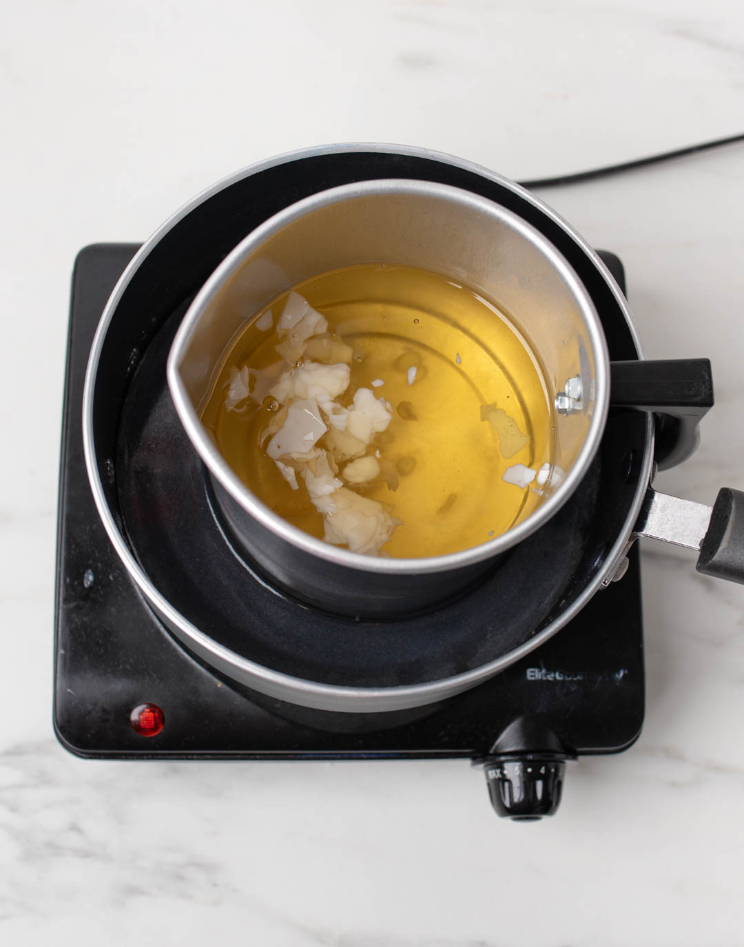 Melting soy wax on a double boiler.