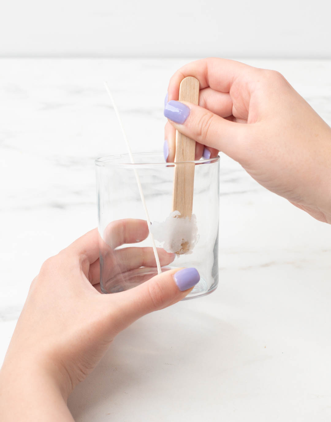 Creating clouds with cooling wax on the sides of a glass candle container.