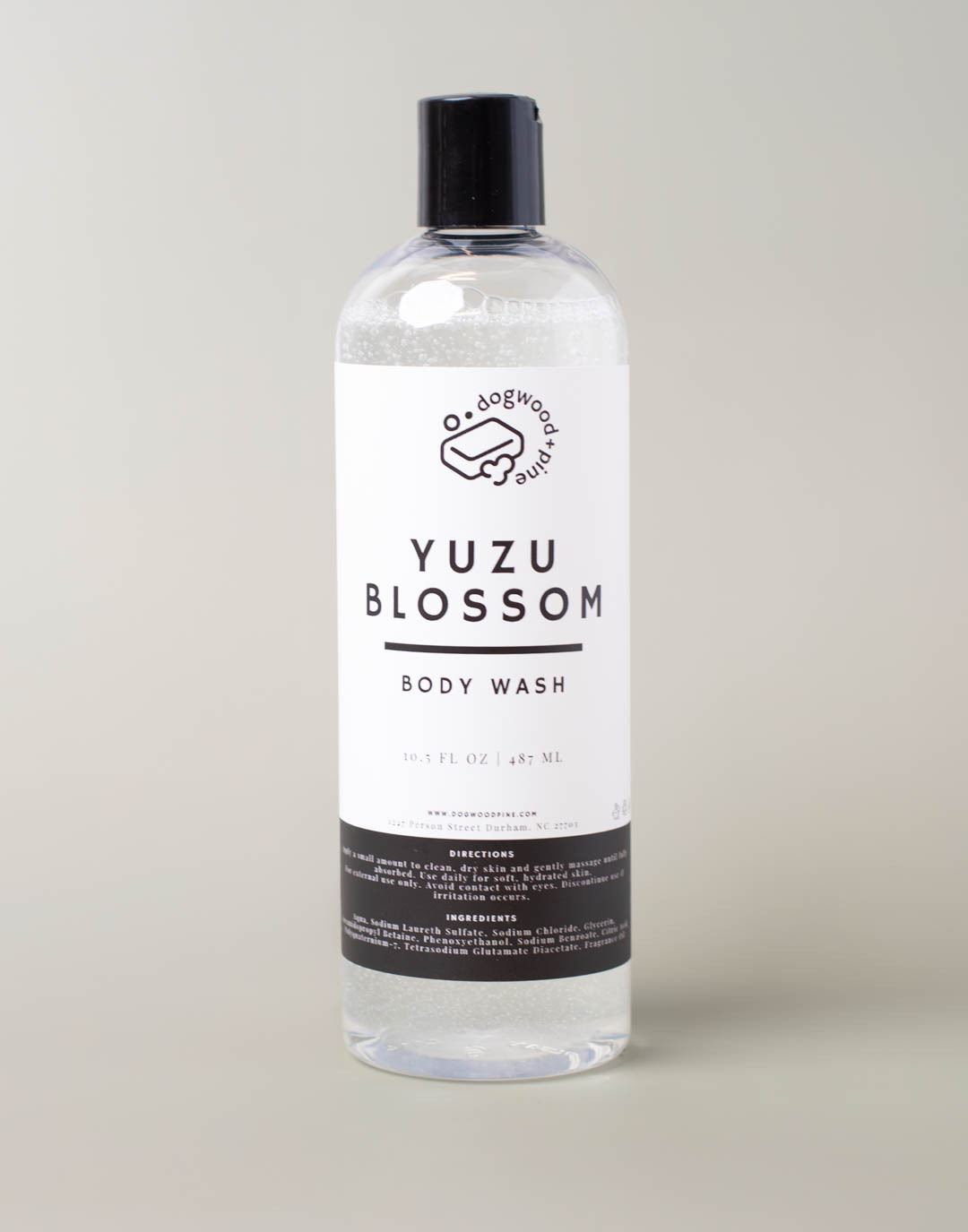 A finished bottle of body wash with a label. 