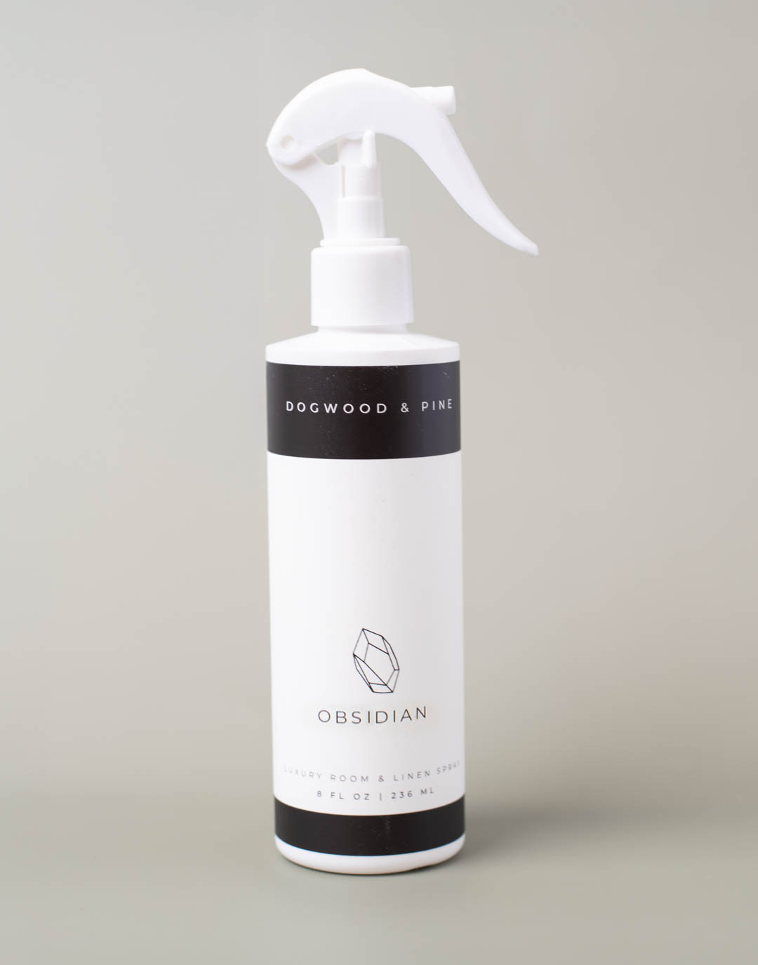 A finished spray bottle of room spray with a label.