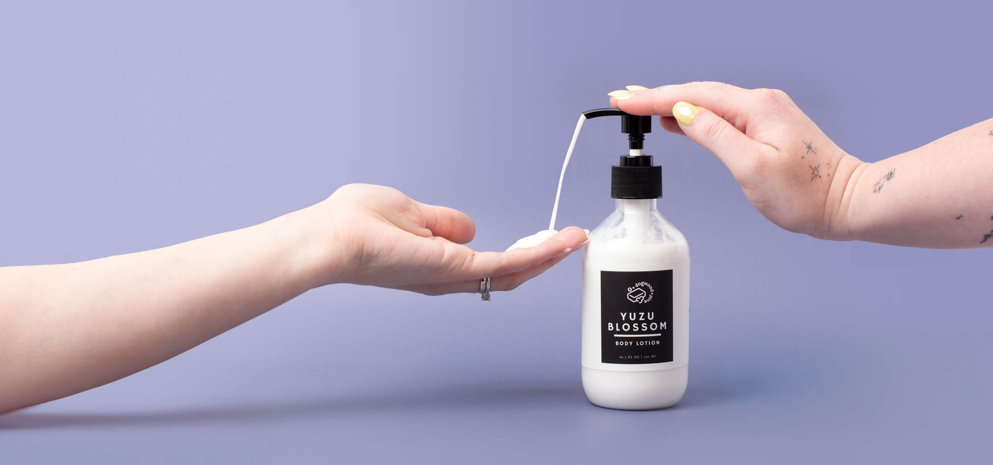 Hands showing how to use scented lotion as a DIY project.