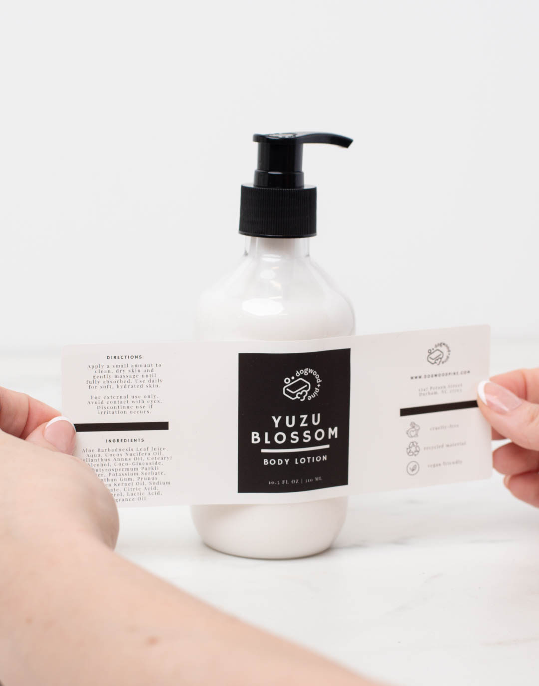 Placing warning label on bottom of diffuser bottle.
