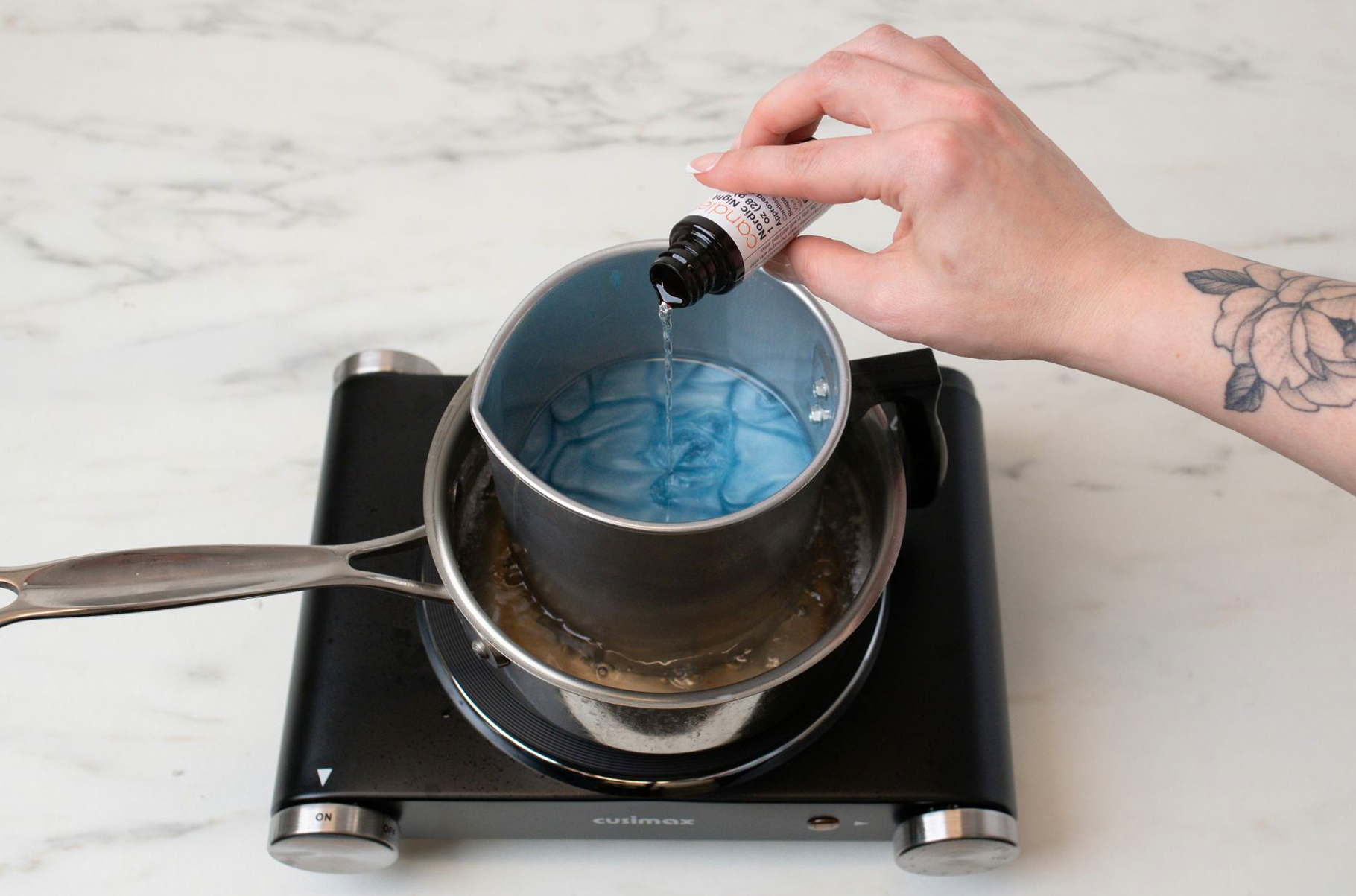 Melting beeswax and adding dye block.