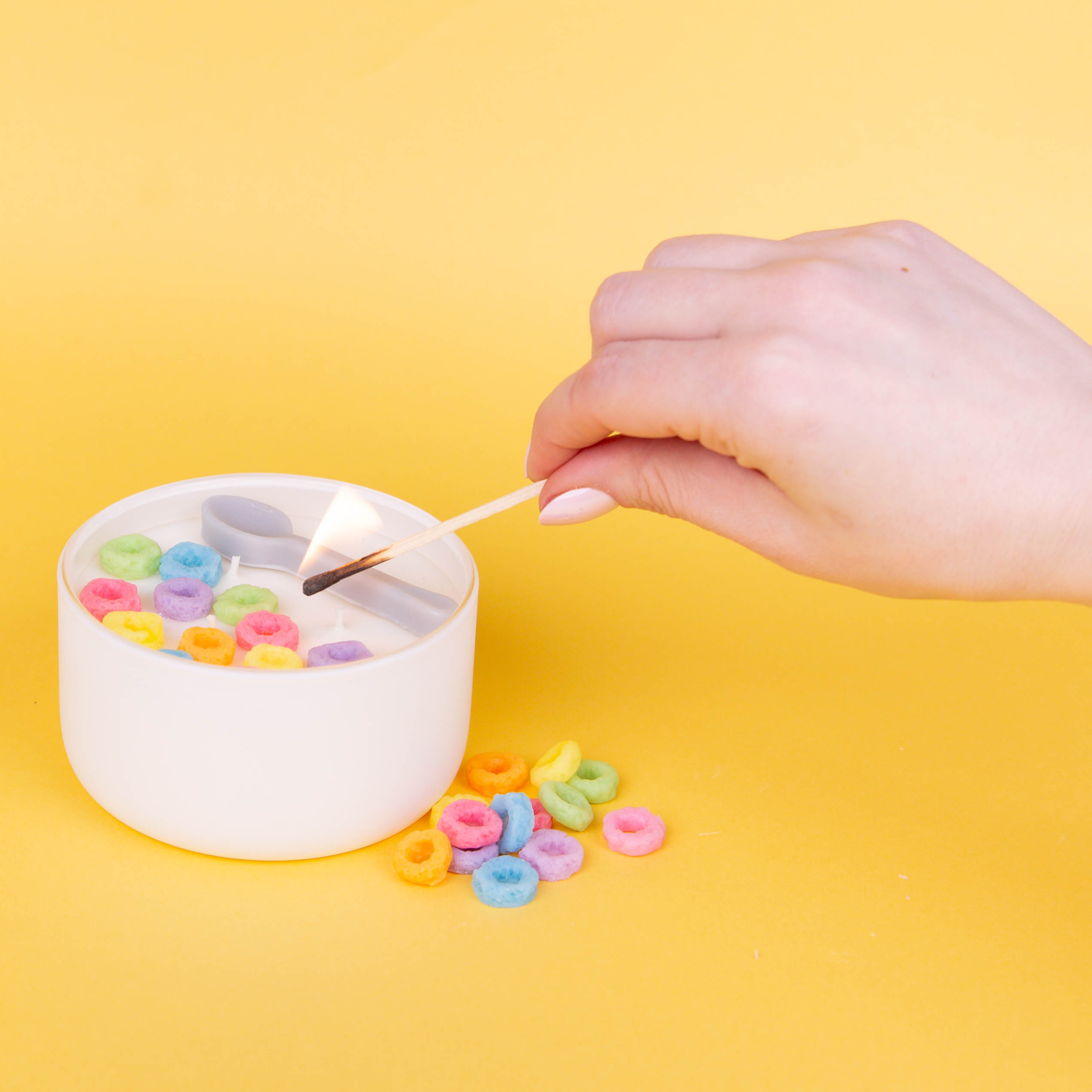 A white heart wax melt melting in a wax warmer revealing a hidden red swirl of dye