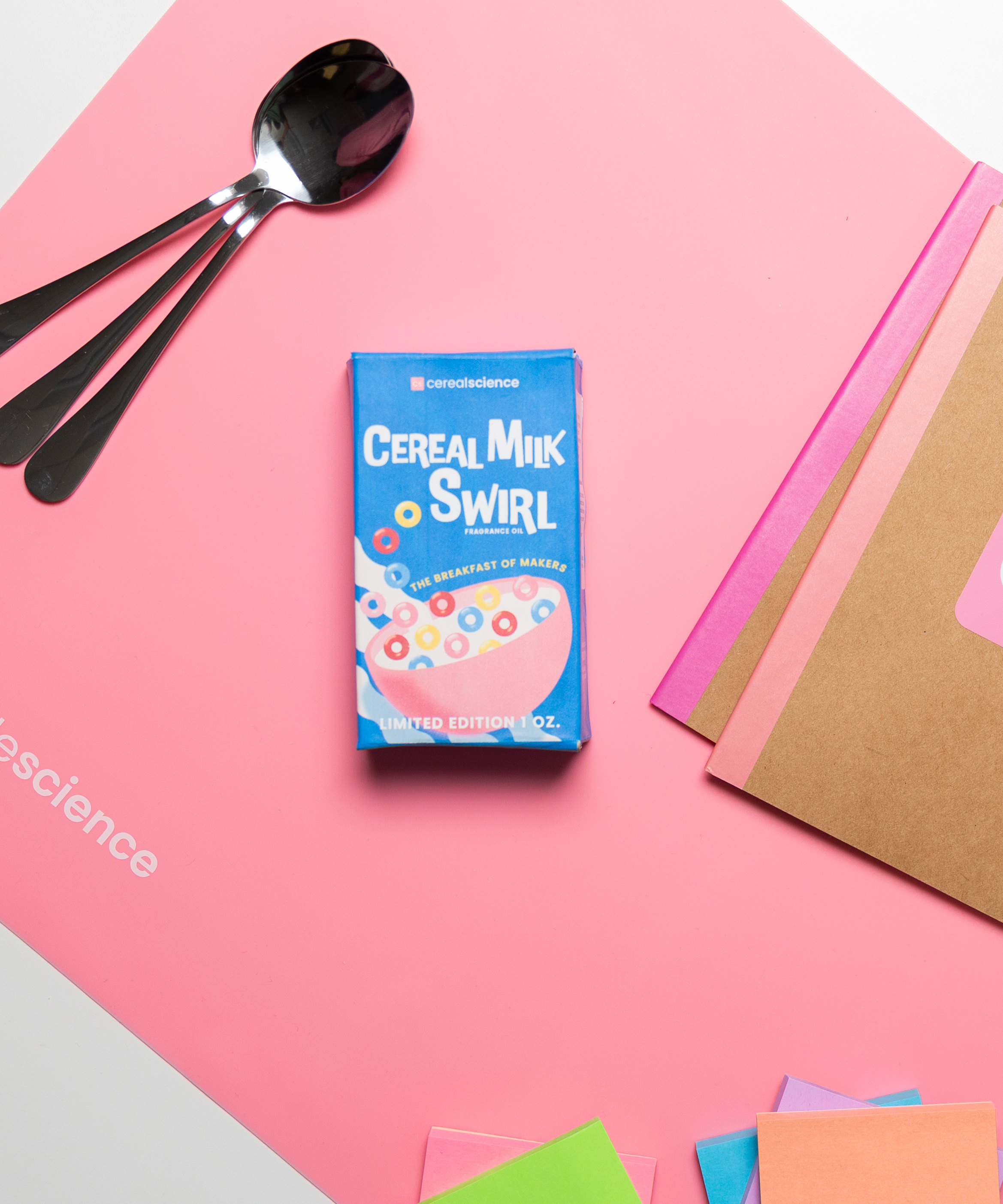 Cereal Milk Swirl cereal box and pink silicone mat.