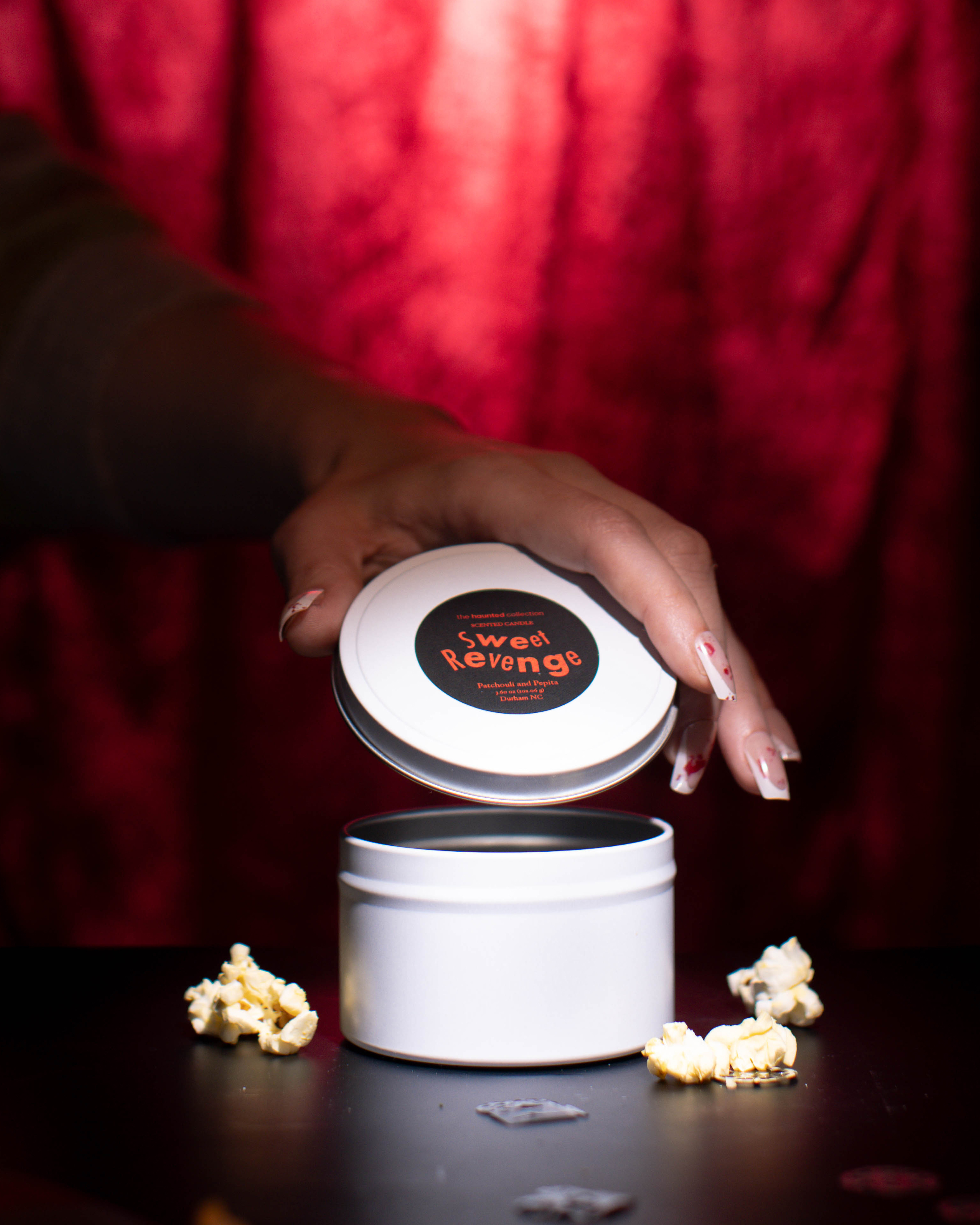 Sweet Revenge white tin candle.