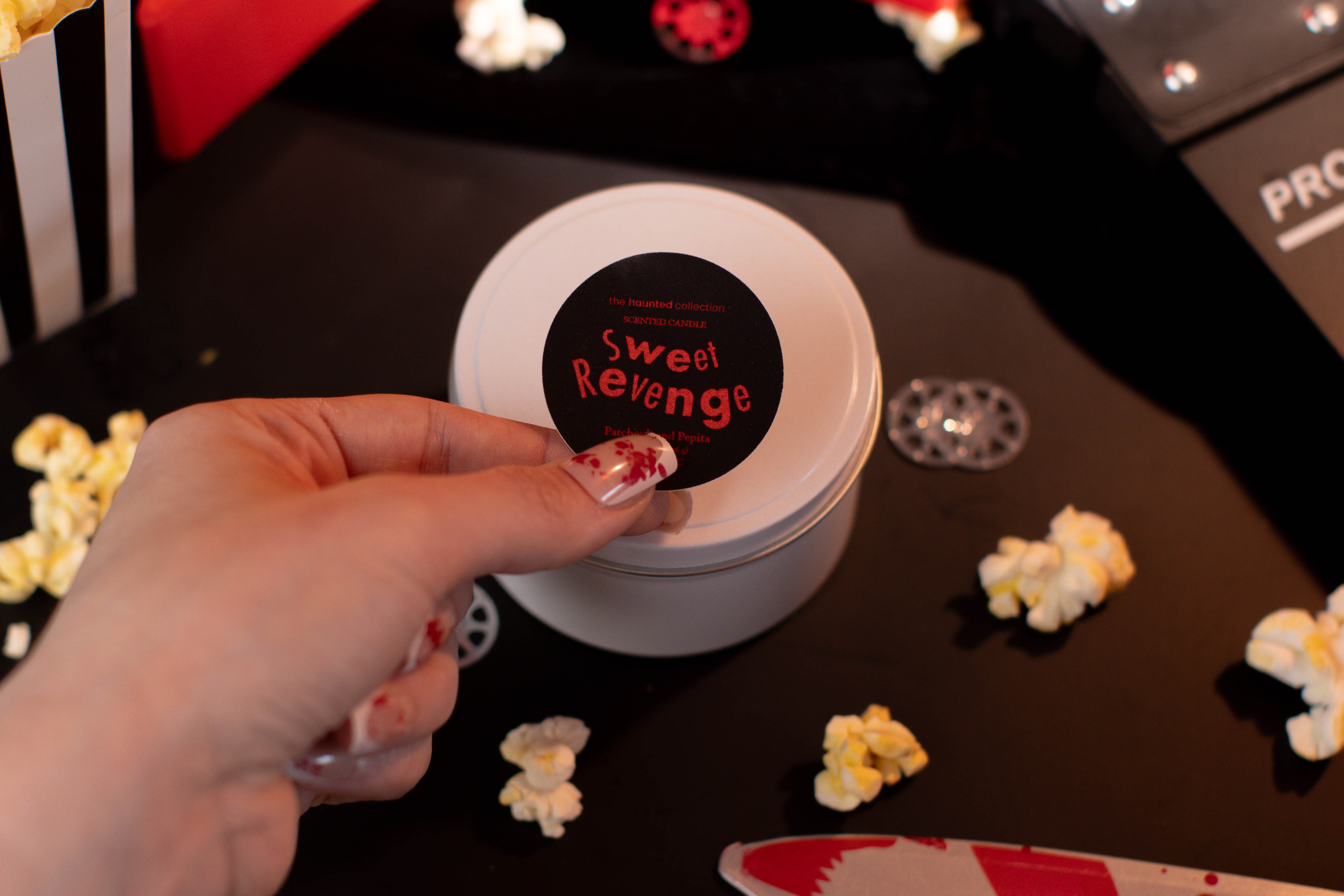 Sweet Revenge white tin candle.