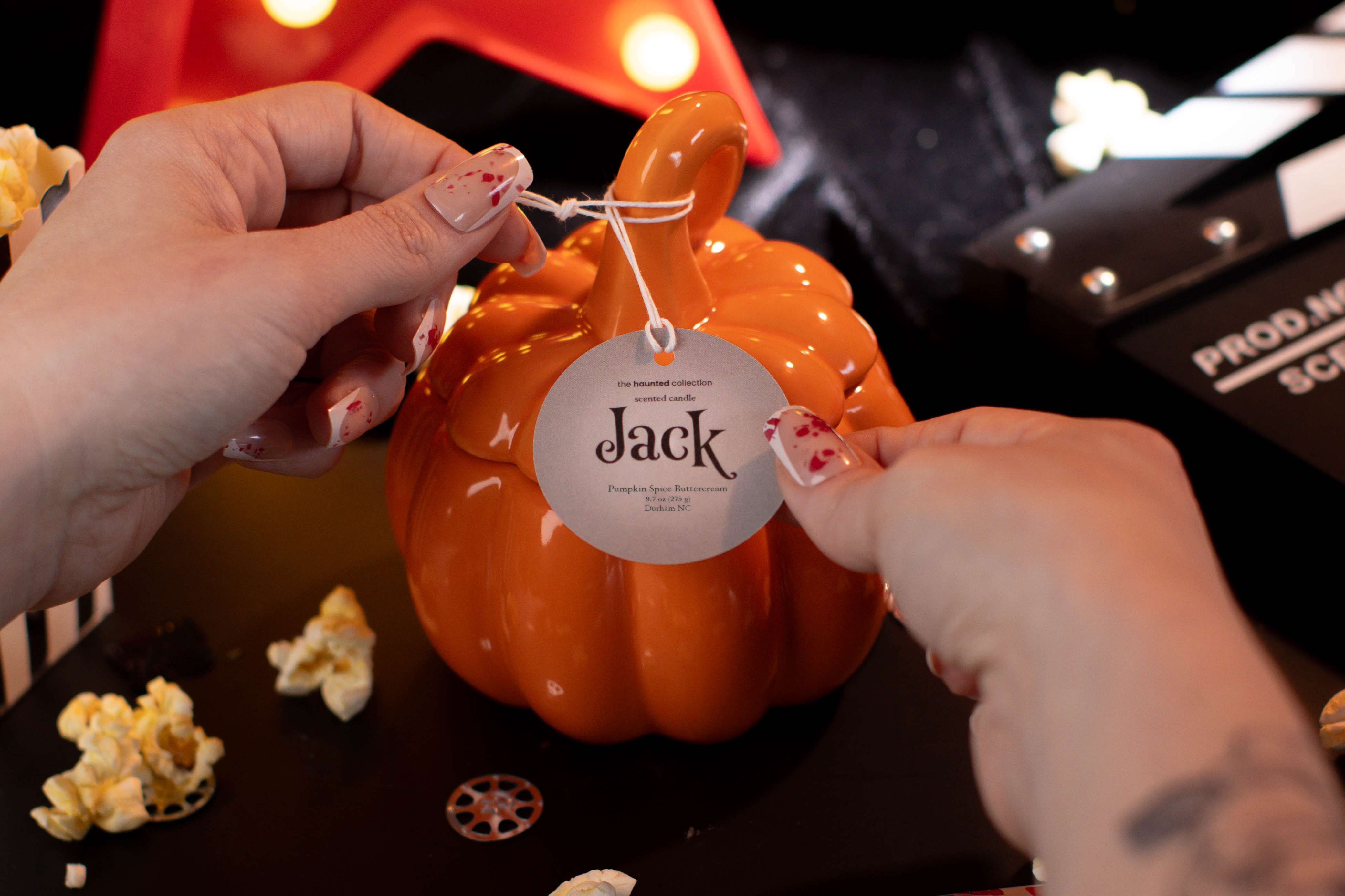 Jack orange stemmed pumpkin candle.