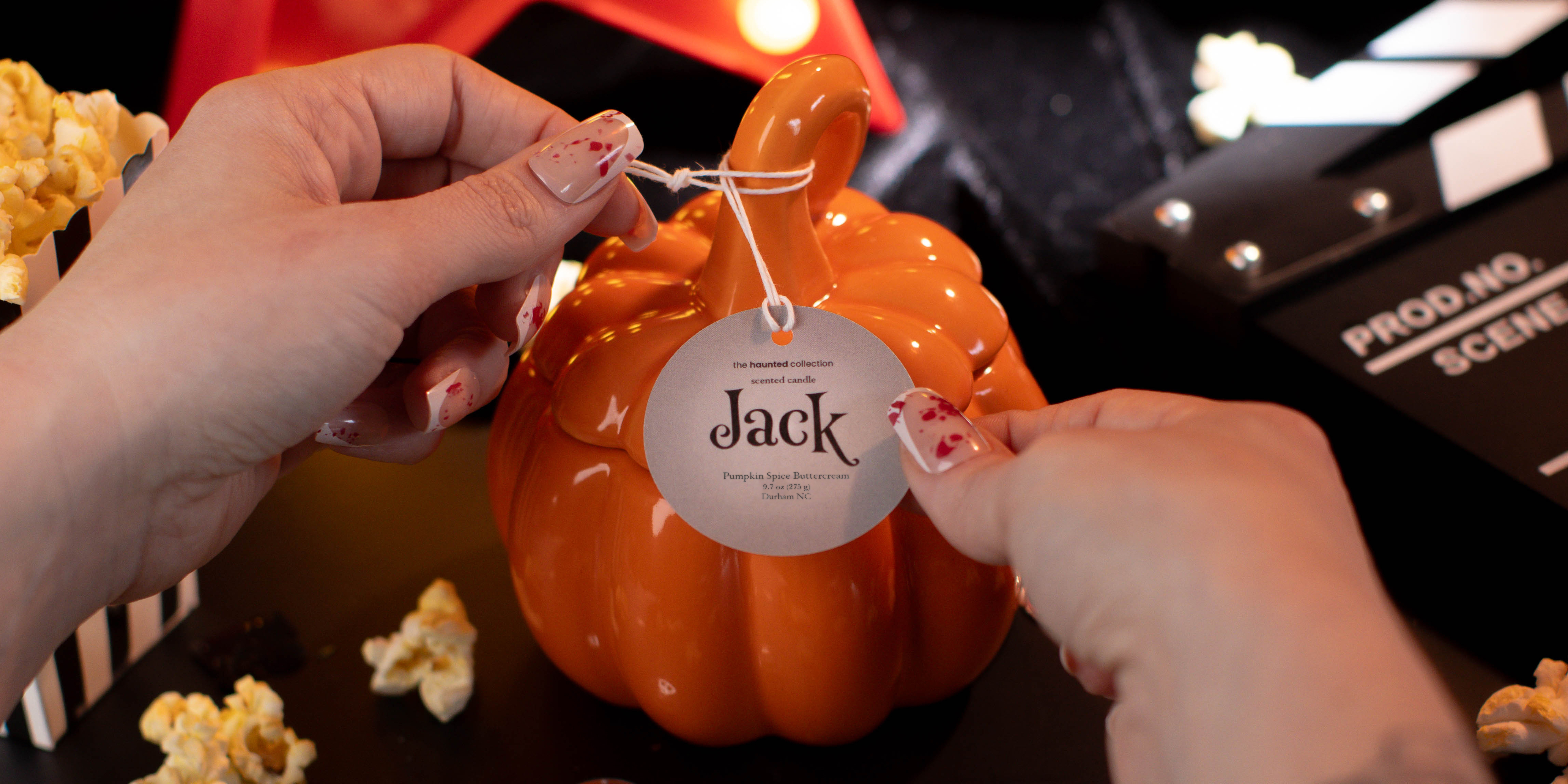 Jack orange stemmed pumpkin candle.
