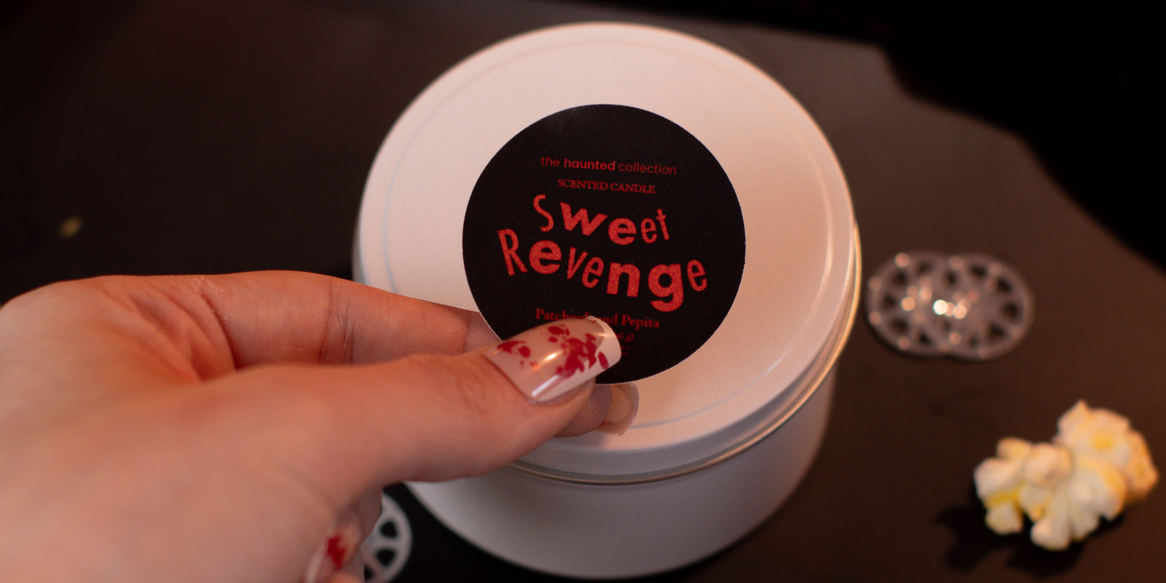 Sweet Revenge white tin candle.