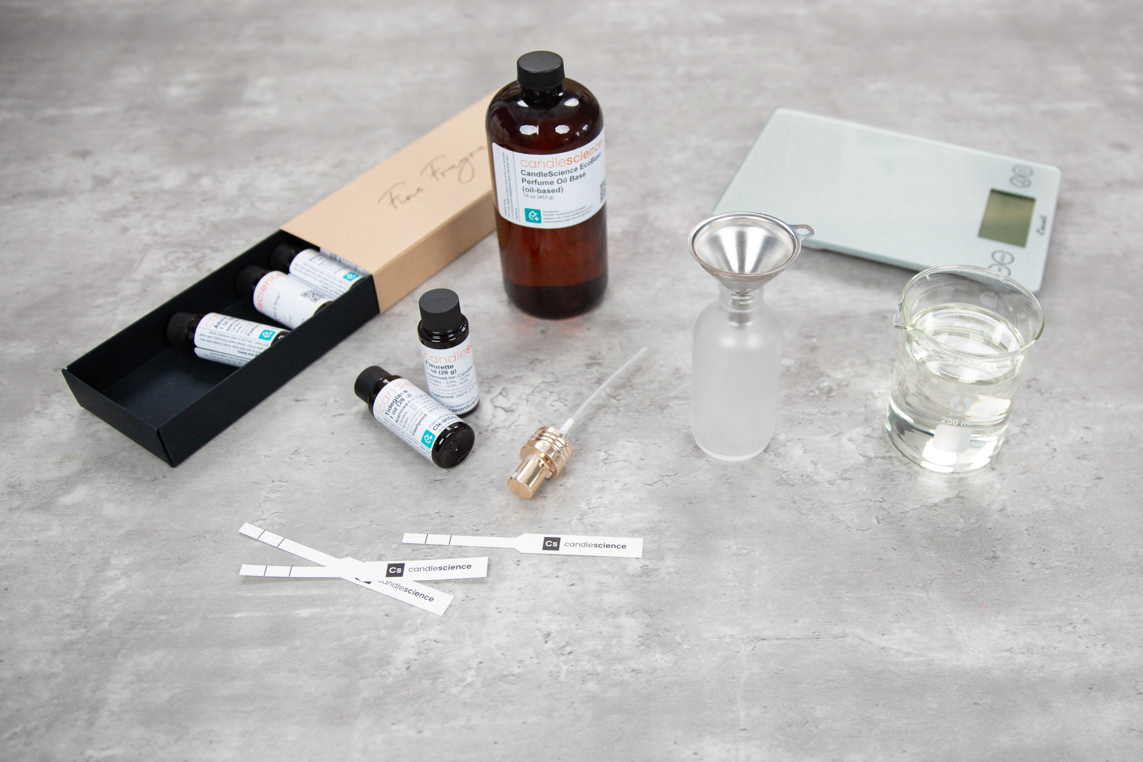 Fine Fragrance Sampler with EcoBase, blotter strips, a scale and other perfume making supplies.