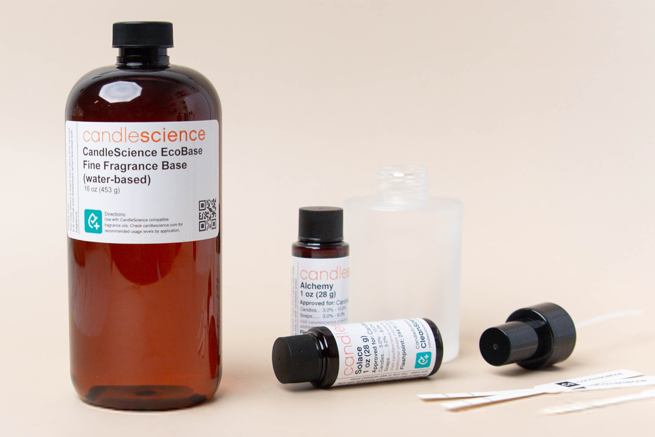 CandleScience EcoBase Fine Fragrance Base with fragrance oil bottles and fine fragrance bottle.