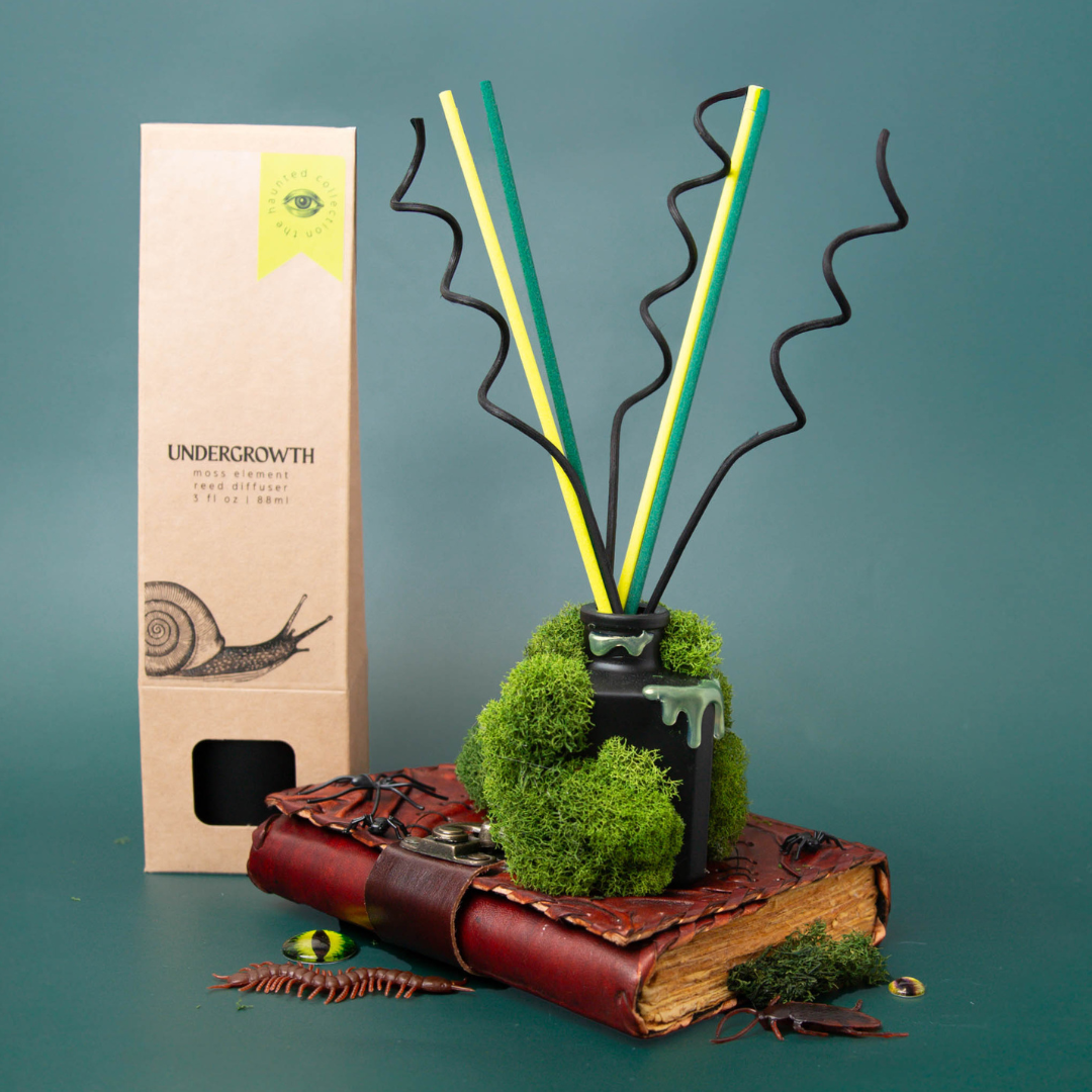 Moss covered reed diffuser.