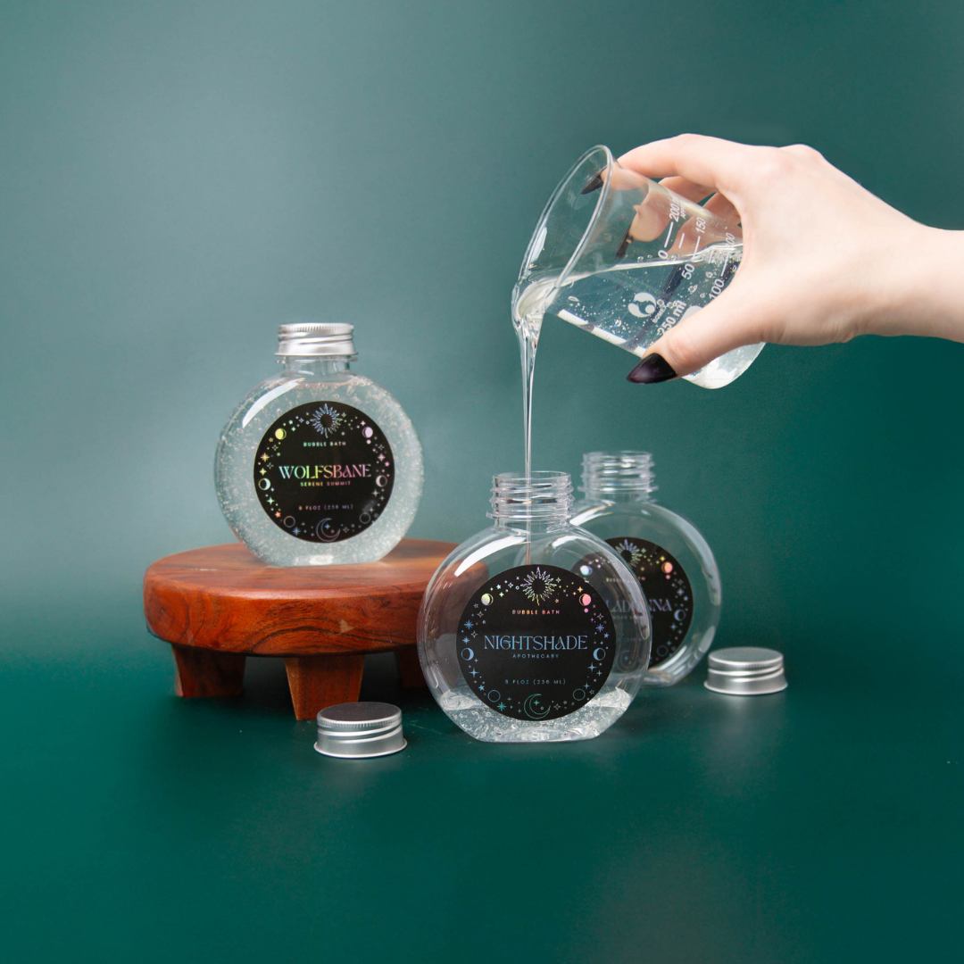 Pouring bubble bath into a bubble bath bottle with a Halloween themed label.