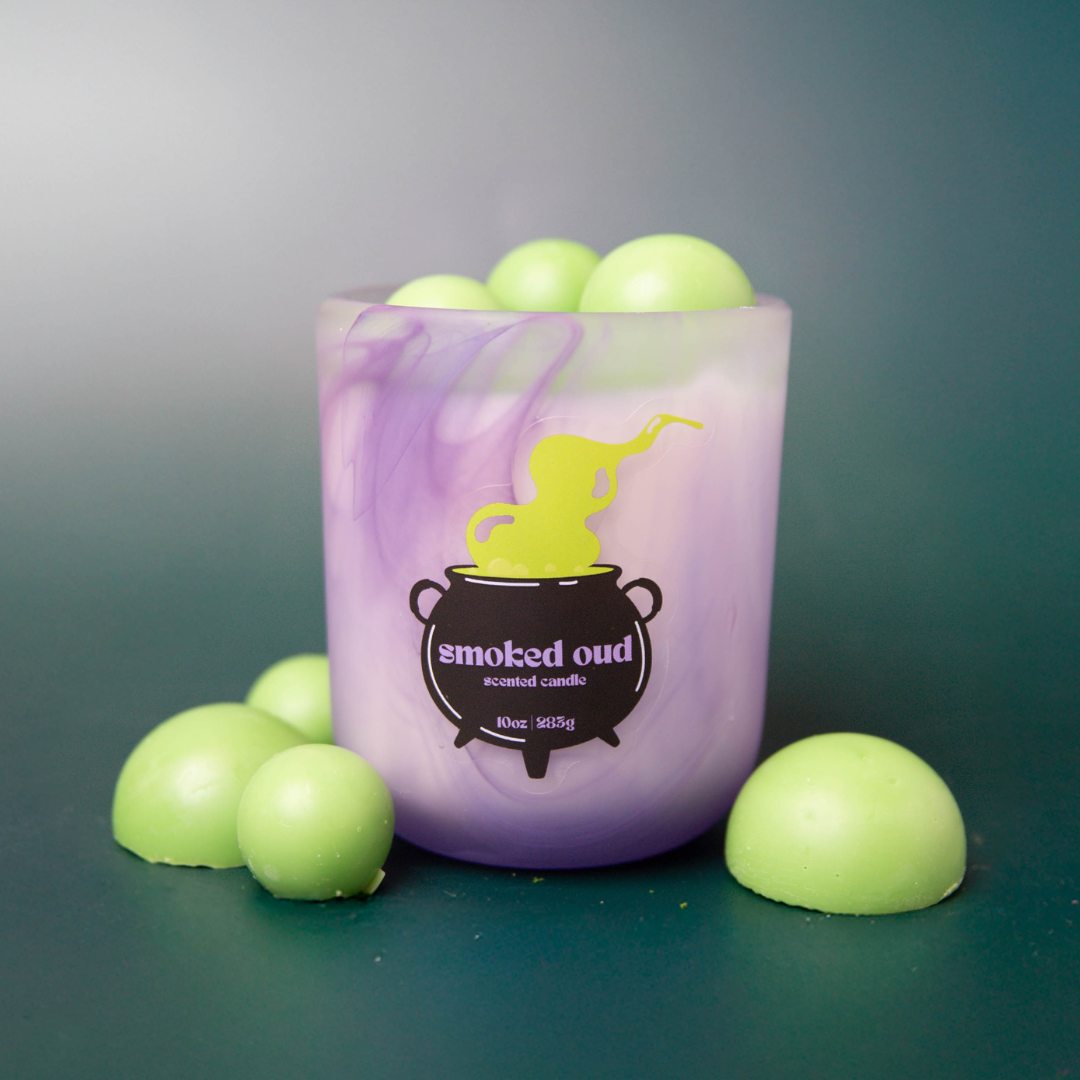 Halloween cauldron themed candle.
