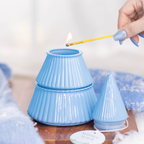 Winter Air candle being lit.