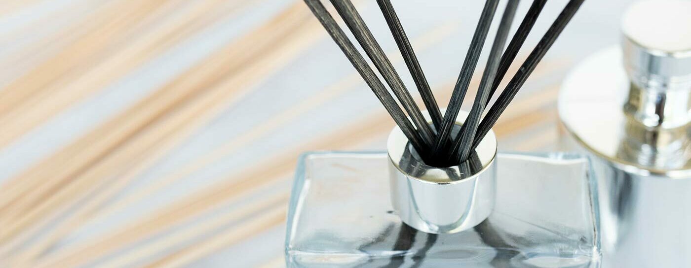 Reed diffuser with black reeds.