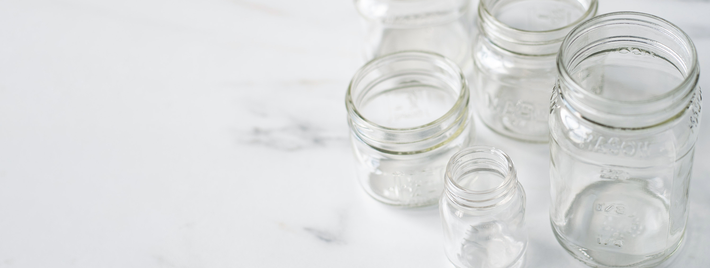 Mason jars in bulk on table