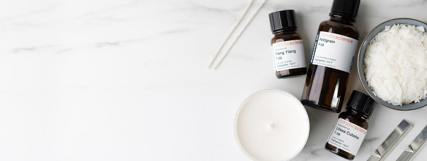 Essential oils, wax, wicks, candle, and wick bars.