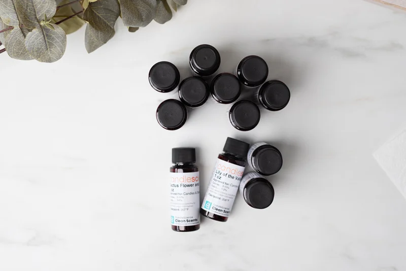 1 oz fragrance oil bottles on a marble surface.